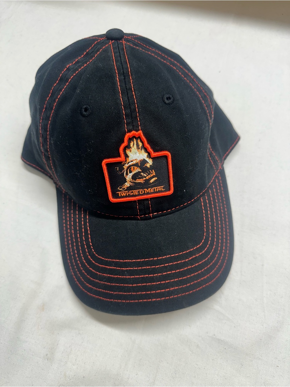 Twisted Black Cap with Orange Flame Logo